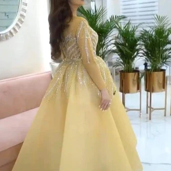 Kristāla balles kleitas 2020. gadam milzīgais apkalpes izgriezums, ar garām piedurknēm kristāla frēzēšana vakara kleitas dzelteno bumbu kleita formālu kleita